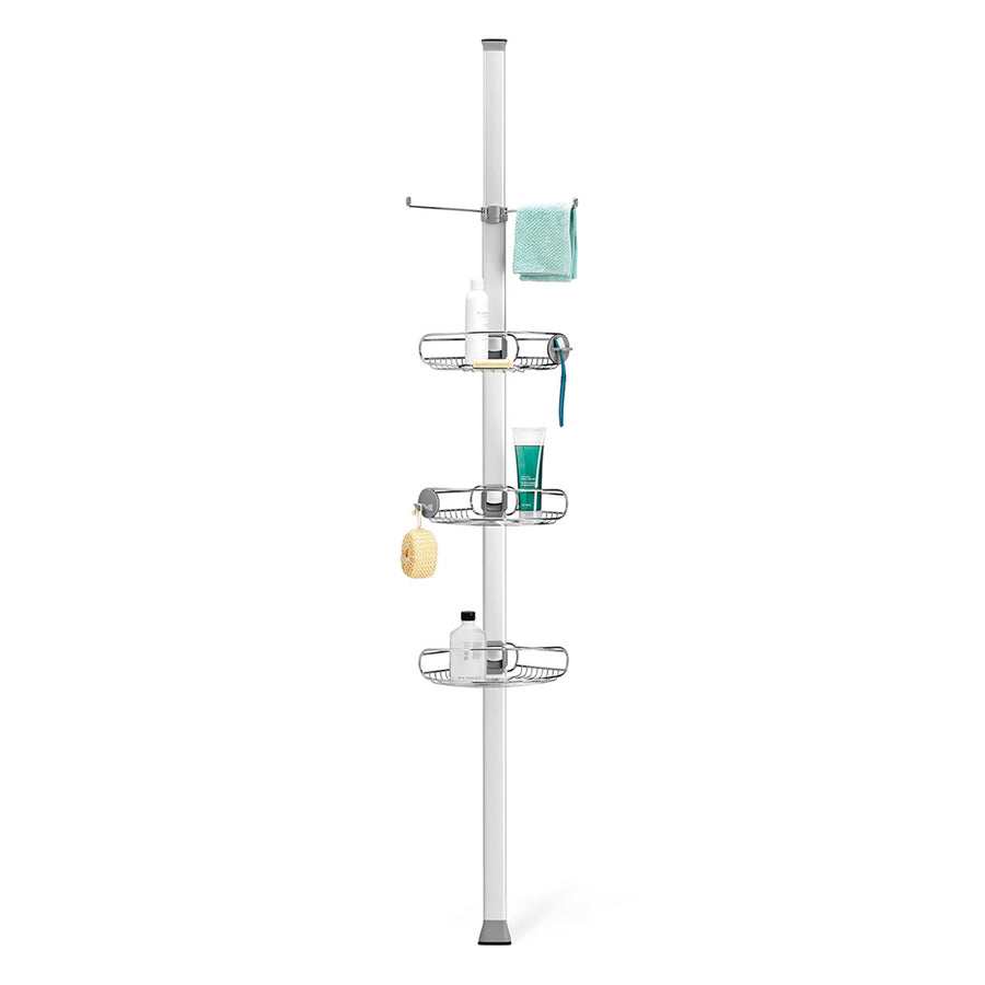 Simplehuman Polished Stainless Steel Tension Shower Caddy. Front view showing 3 adjustable baskets, towel bar, and utility hooks.